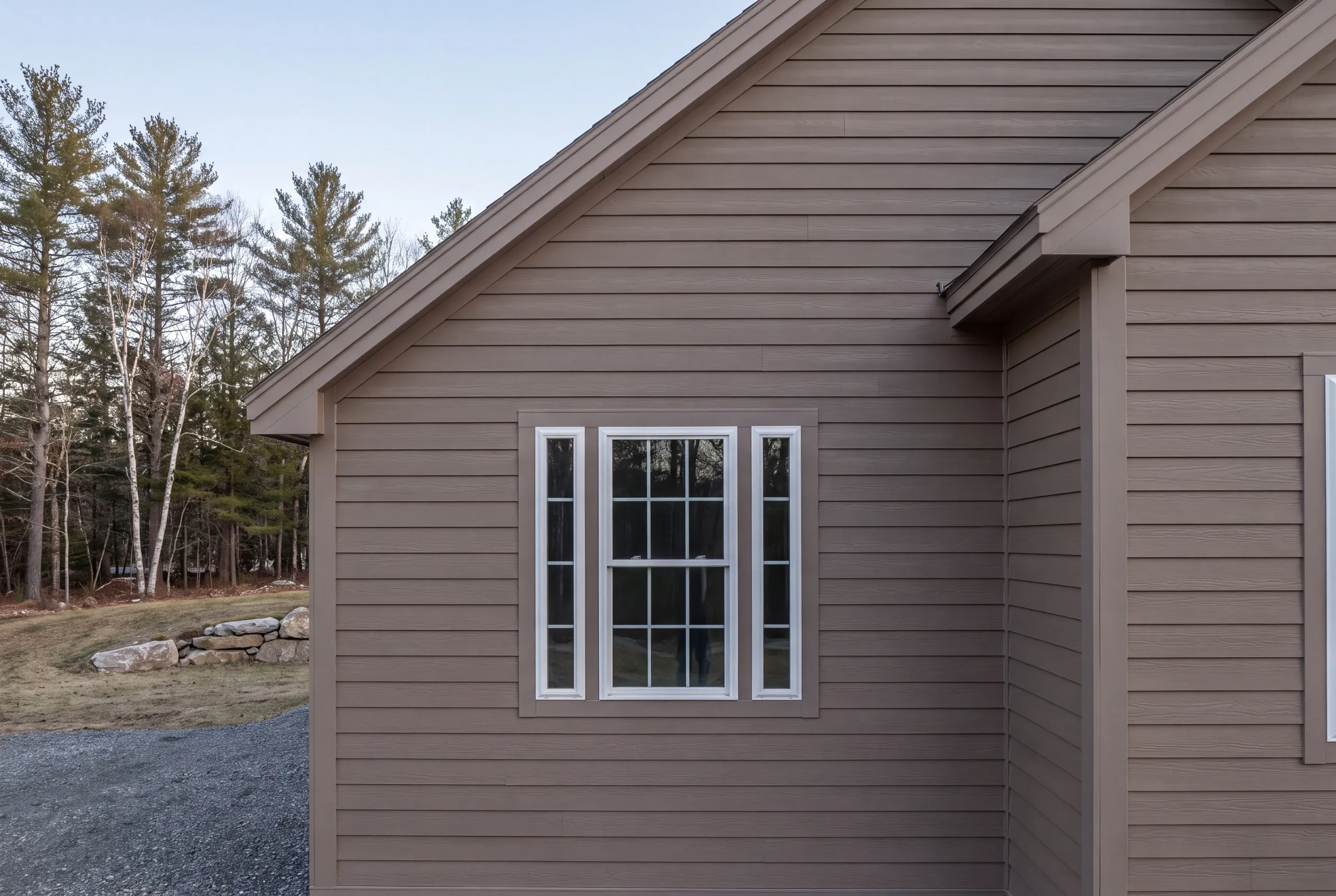 Finished siding, corner boards and window trim along the side of a Vienna home